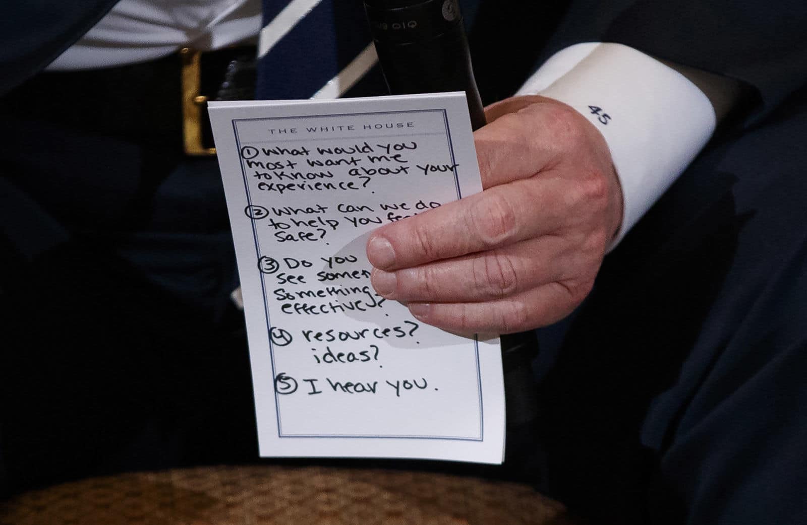 President Donald Trump holds notes during a listening session with high school students and teachers in the State Dining Room of the White House in Washington, Wednesday, Feb. 21, 2018. Trump heard the stories of students and parents affected by school shootings, following last week's deadly shooting in Florida. (AP Photo/Carolyn Kaster)