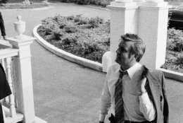 Vice President Walter Mondale, carrying his coat on a hot day in the capital, arrives at his official residence after what he called "a typical day" at his offices in the White House and in the Executive Office Building next door, Monday, July 19, 1977 in Washington. (AP Photo)