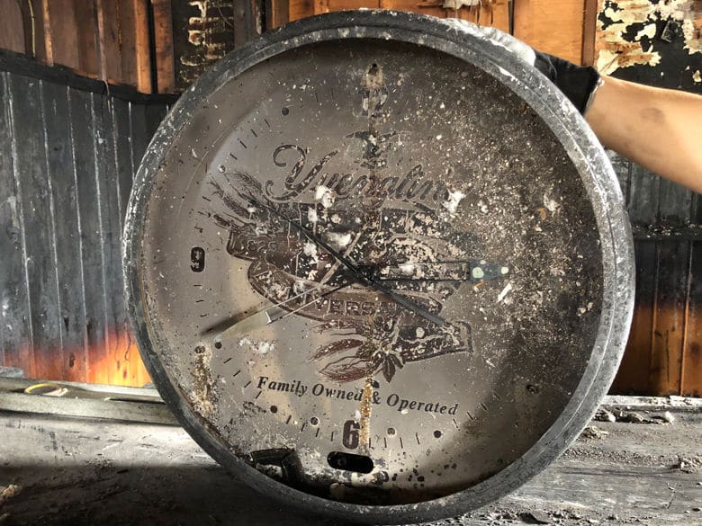 A clock from the bar was badly damaged by the intense blaze. (WTOP John Aaron)
