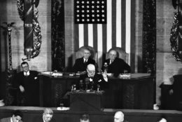 British Prime Minister Winston Churchill gestures with his left hand and looks over the top of his glasses as he tells a joint session of Congress in Washington, D.C., We take our stand at your side on Jan. 17, 1952. He pledged that Britain will do her part in defending Europe. (AP Photo)