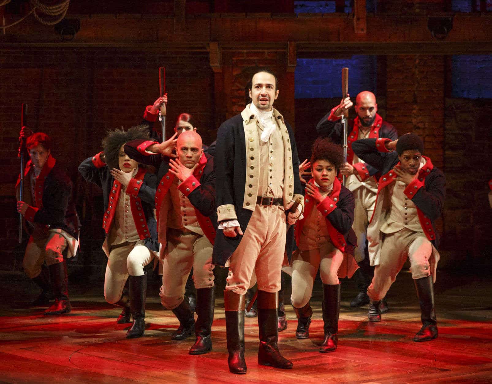 This image released by The Public Theater shows Lin-Manuel Miranda, foreground, with the cast during a performance of "Hamilton," in New York. (Joan Marcus/The Public Theater via AP)