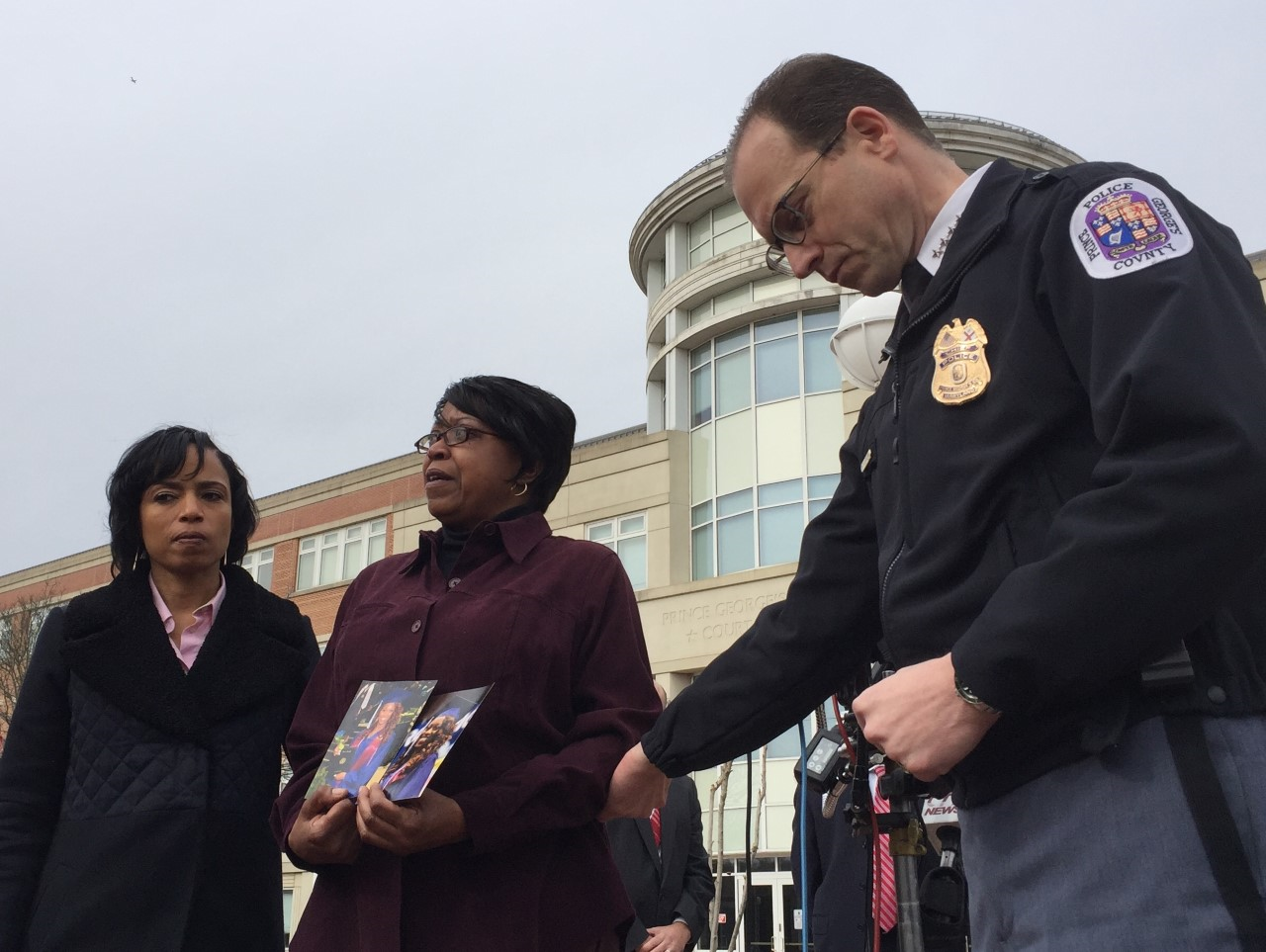 Lydia Banks talks about her daughter Allyssa, who was killed in October 2016. She's supported by Prince George's County State's Attorney Angela Alsobrooks, at left, and Police Chief Hank Stawinski, at right. (WTOP/Kristi King)