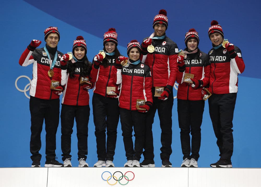 Team figure skating gold medalists from Canada pose during their medals ceremony at the 2018 Winter Olympics in Pyeongchang, South Korea, Monday, Feb. 12, 2018. (AP Photo/Jae C. Hong)