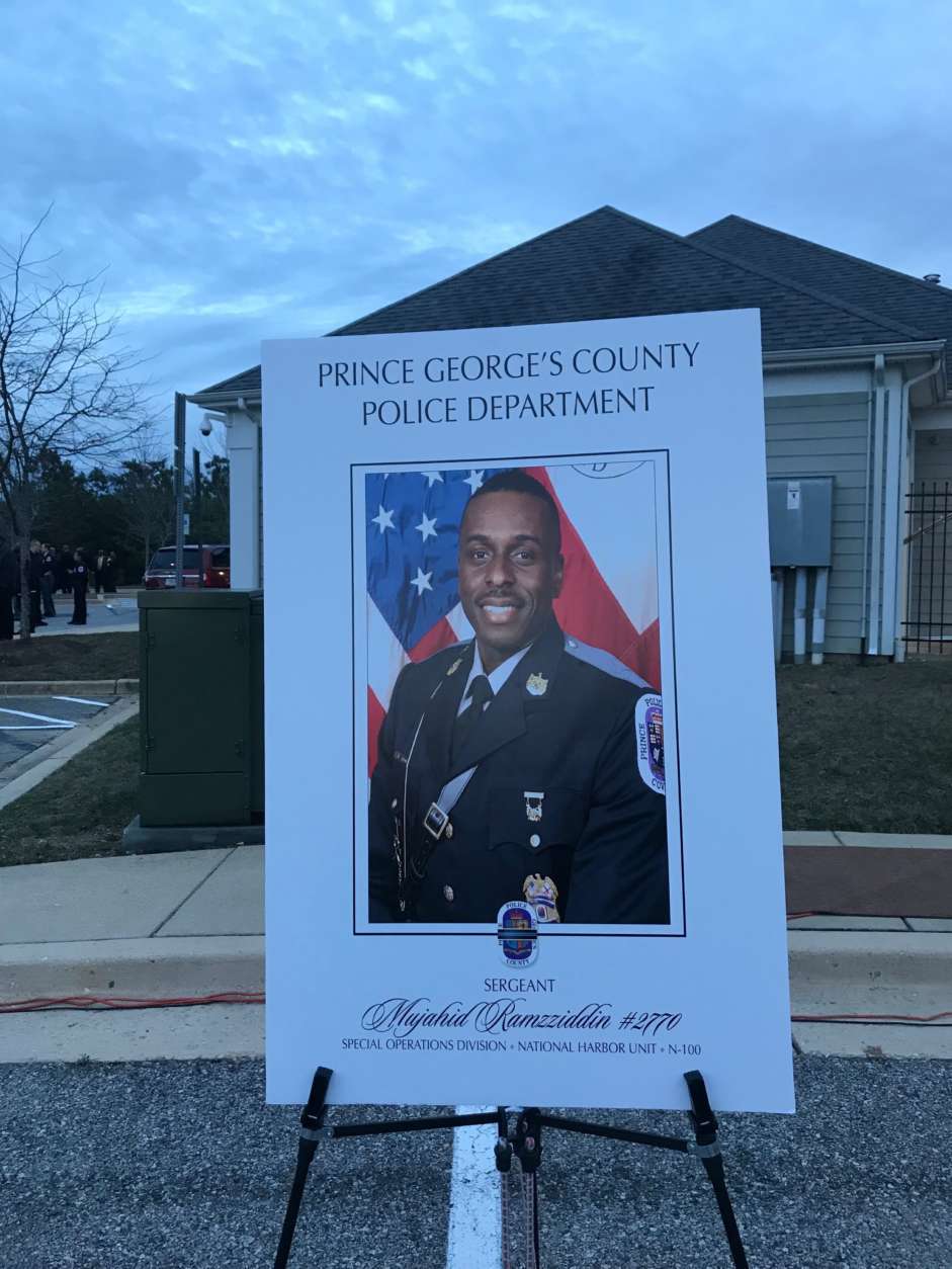 A vigil is held for Prince George's County police officer Mujahid Ramzziddin, who was killed on Feb. 21, 2018. (WTOP/Dick Uliano)