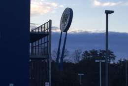 Powerful winds have caused the sign for Potomac Mills to lean dangerously. (WTOP/John Domen)
