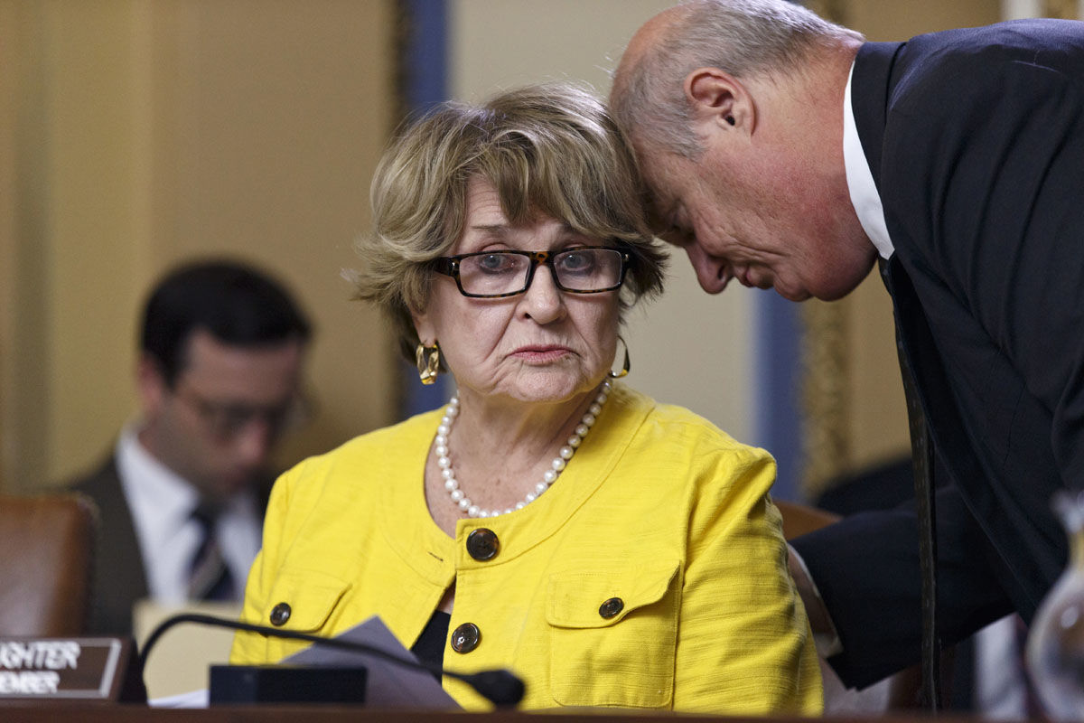 House Rules Committee ranking member Rep. Louise Slaughter, D-N.Y., confers with Minority Staff Director Miles Lackey, right, on Capitol Hill in Washington, Tuesday, July 29, 2014, as the panel meets to take the procedural steps to authorize the House to initiate litigation against President Barack Obama for failing to carry out his duties as required by the Constitution regarding the Affordable Care Act. (AP Photo/J. Scott Applewhite)