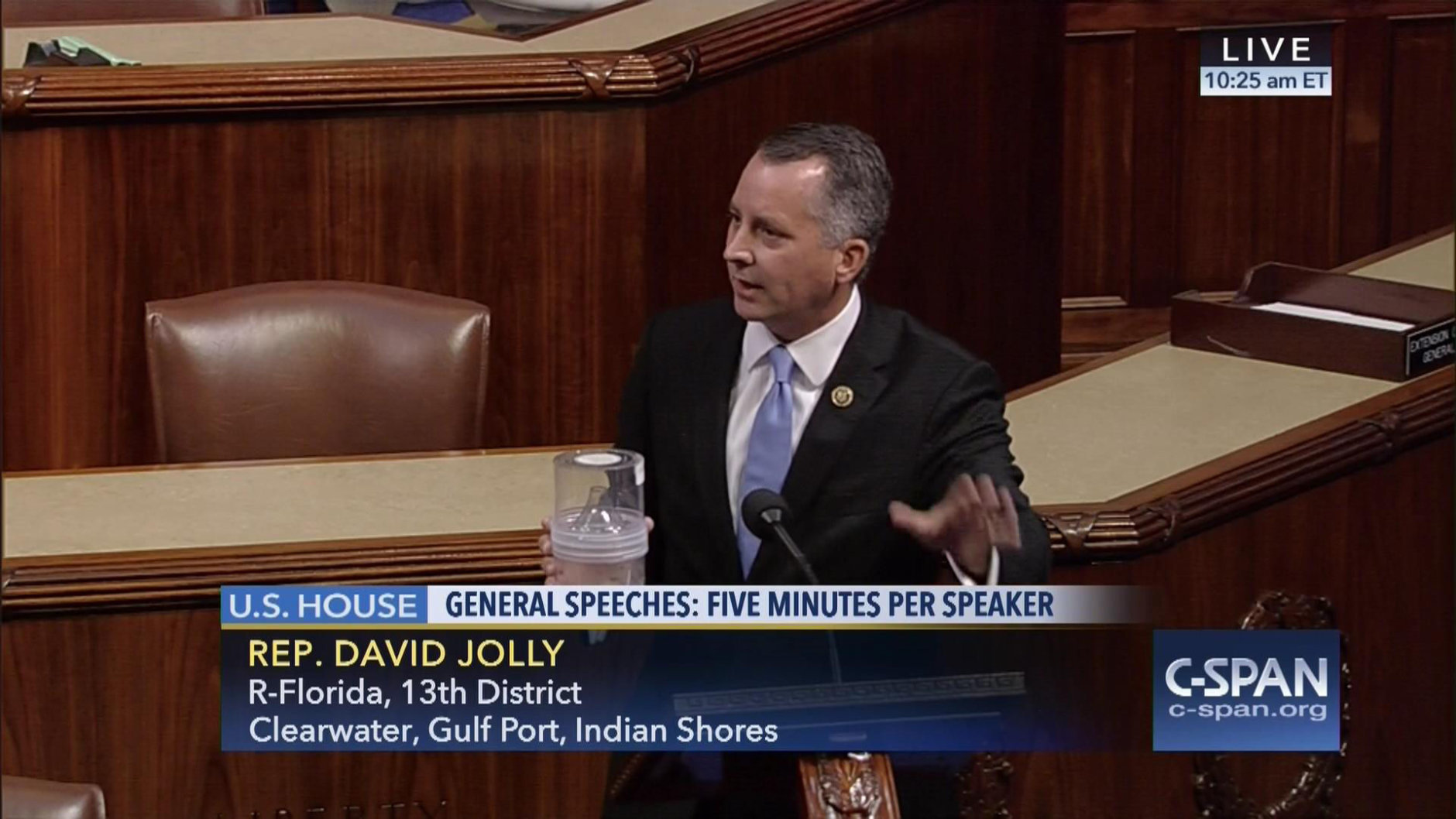 In this frame grab from video provided by C-SPAN, Rep. David Jolly, R-Fla. holds a container of mosquitoes while speaking of the House floor on Capitol Hill in Washington, Wednesday, Sept. 7, 2016. "The politics of Zika are garbage right now," the Florida lawmaker said in a short, angry speech condemning Congress for failing to pass legislation providing $1.1 billion to combat the mosquito-borne virus.  (C-SPAN via AP)