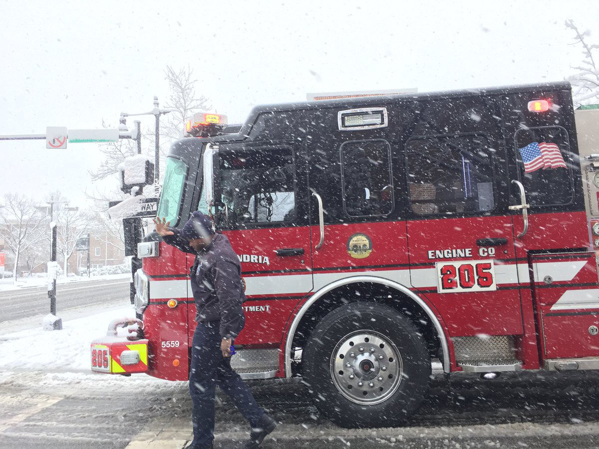 The Alexandria Fire Department responds to a call of a "slip and fall" at the intersection of S. Washington and Franklin Street. (WTOP/Kristi King)