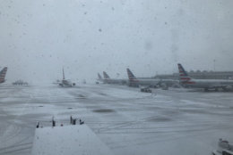 As the snowfall increases, so do the number of cancellations at D.C. area airports. (WTOP/John Aaron)
