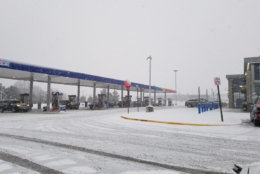 By 8:40 a.m. on March 21, snow was starting to stick to the ground at this gas station by Dulles International Airport. (Courtesy Marcus via Twitter)