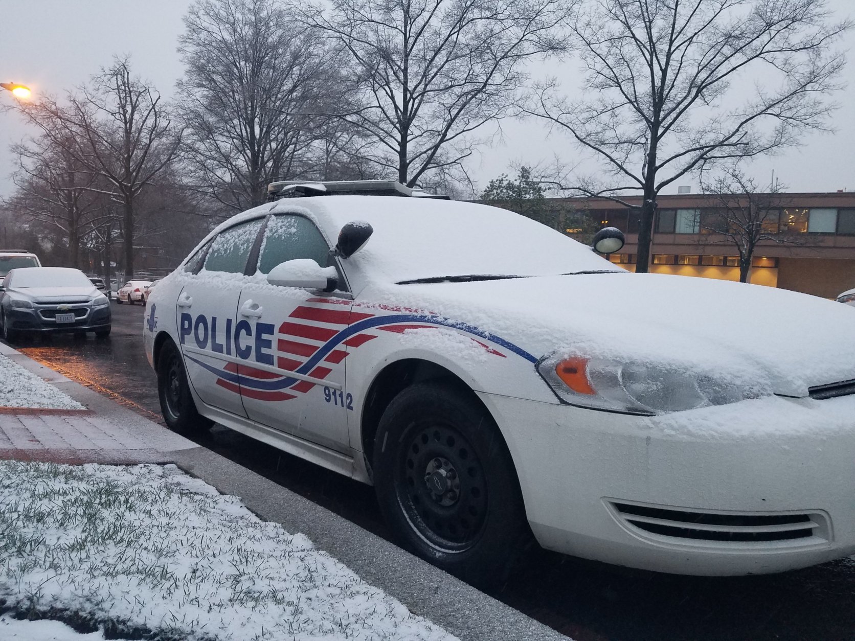 Snow collects on a police car in Northwest D.C. Wednesday, March 21. (WTOP/William Vitka)