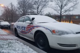 Snow collects on a police car in Northwest D.C. Wednesday, March 21. (WTOP/William Vitka)