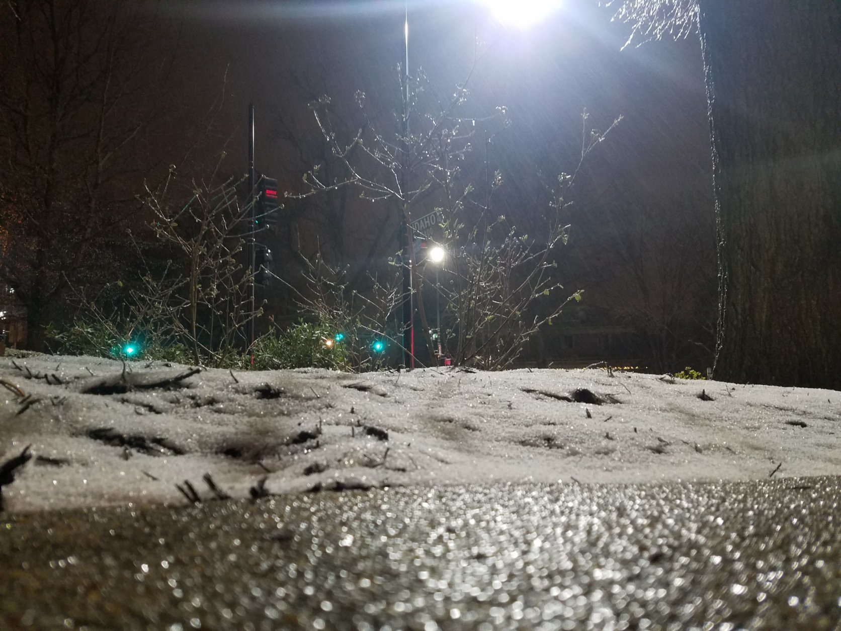 Snow and ice coat the ground in Northwest D.C. Wednesday, March 21. (WTOP/William Vitka)