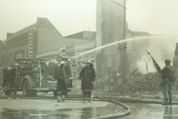 Firefighters near the rubble of what was once a liquor store at Seventh and P streets. (Courtesy D.C. Fire and EMS Museum)