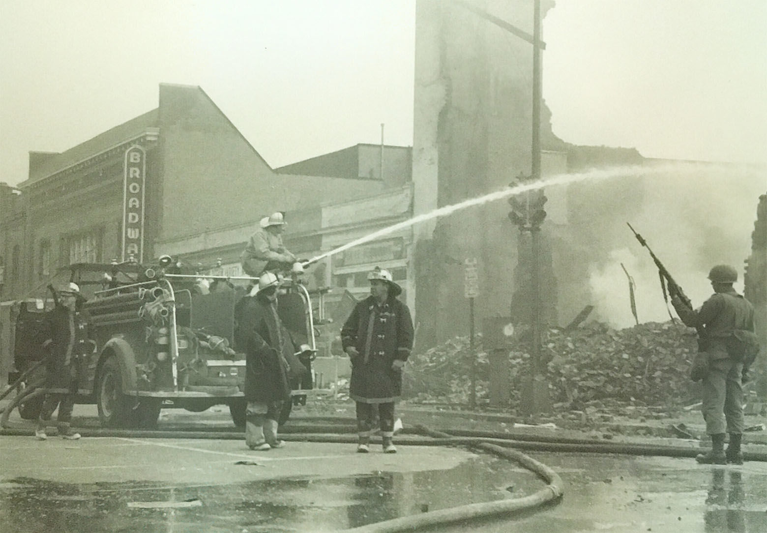 Firefighters near the rubble of what was once a liquor store at Seventh and P streets. (Courtesy D.C. Fire and EMS Museum)