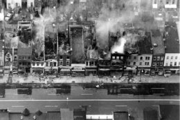 This aerial photo shows fire-gutted buildings, some still smouldering, along a block on H Street between 12th and 13th Streets in the northeast section of Washington, D.C. on April 5, 1968. Rioting broke out after the assassination of civil rights leader Dr. Martin Luther King, Jr., in Memphis, Tenn. on April 4. (AP Photo)