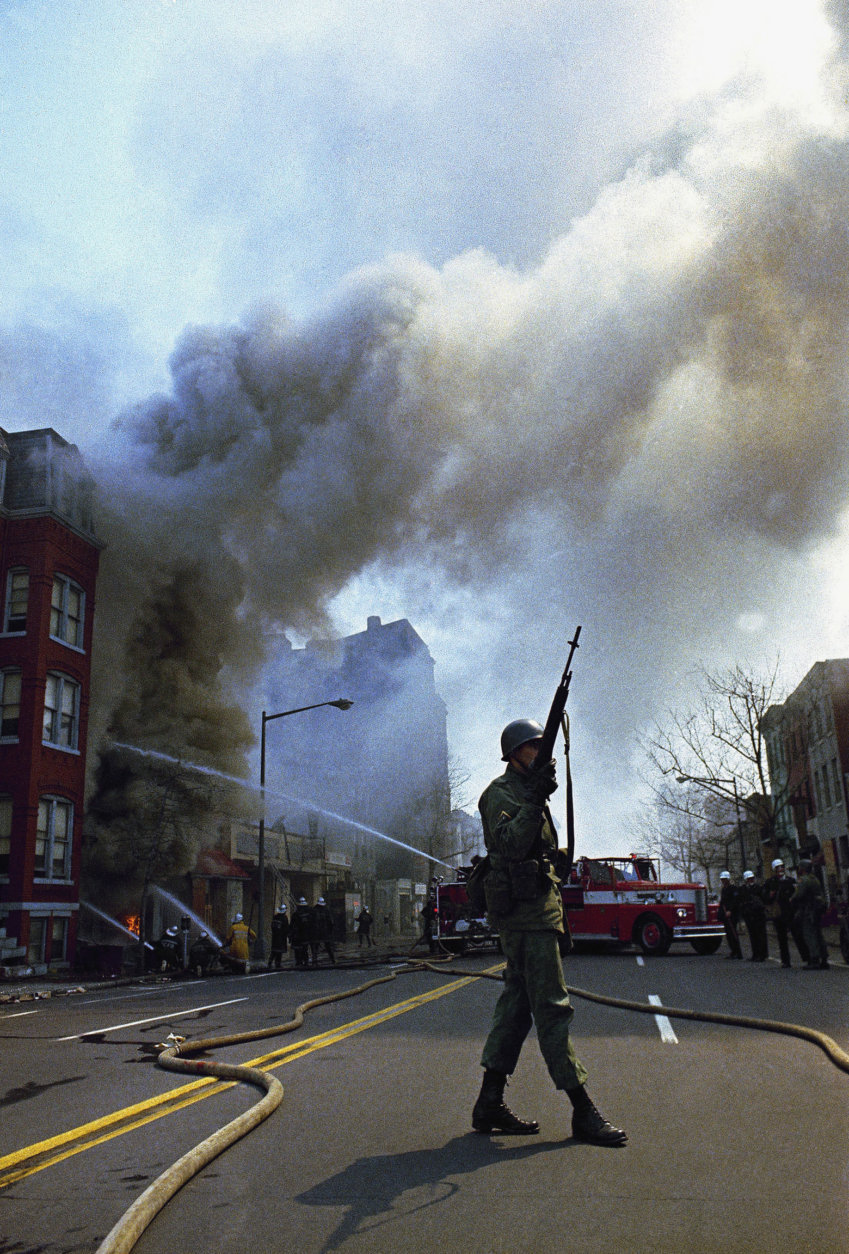 Firemen and the National Guard were called out to quell rioting that broke out in Washington following the news of the assassination of Dr. Martin Luther King Jr., April 6, 1968.  (AP Photo)
