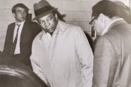 Mayor Walter E. Washington (center) prepares for a near-midnight tour of the damage after window-breaking, looting and arson broke out late in the evening April 4, 1968 after the assassination of Dr. Martin Luther King in Memphis. Paul Delaney (in foreground) hopped in the back of the mayor's car for a backseat view of history as the nation's first black mayor surveyed the destruction in the city. (Courtesy Paul Delaney)