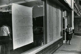 The unrest prompted a strict curfew for several days. This store carries a sign reading: "Due to curfew we must cose at 3:30. Open Monday 9 a.m." Reprinted with permission of the DC Public Library, Star Collection, © Washington Post.