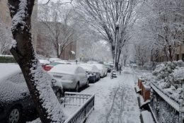 Snow covered sidewalks and cars along 17th Street NW.  (WTOP/Lisa Weiner)