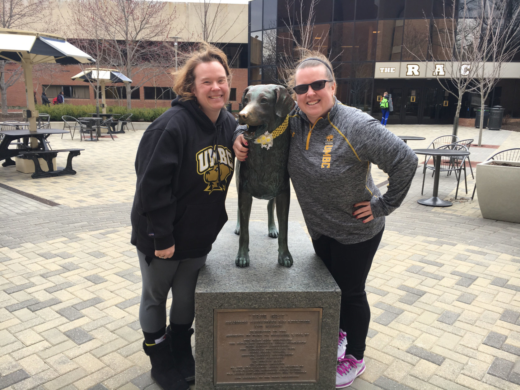 Twin sisters and UMBC alumni Heather Hensgen, left, and Holly Owens had to come see campus after Friday night’s win. (WTOP/Keara Dowd)