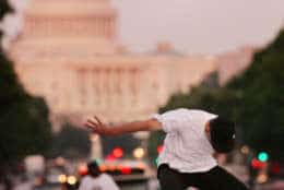 With the U.S. Capitol in the background, Mike Mascelli, of Virginia, skates at Pulaski Park, Tuesday, June 17, 2008, in Washington. (AP Photo/Haraz N. Ghanbari)