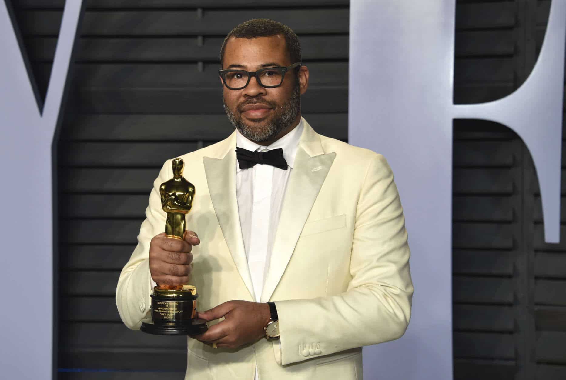 Jordan Peele, winner of the award for best original screenplay for "Get Out," arrives at the Vanity Fair Oscar Party on Sunday, March 4, 2018, in Beverly Hills, Calif. (Photo by Evan Agostini/Invision/AP)