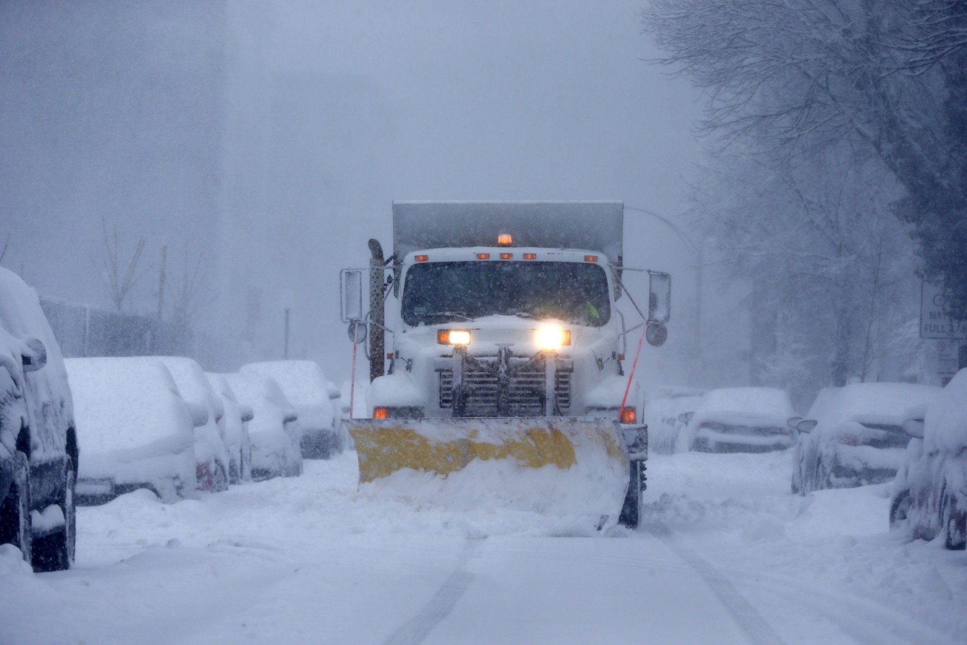 A plow clears Marginal Street in Boston, Tuesday, March 13, 2018. Boston finds itself in the bullseye of the third nor'easter in two weeks, with forecasters warning of up to 18 inches of snow and 2 feet or more to the south. (AP Photo/Michael Dwyer)