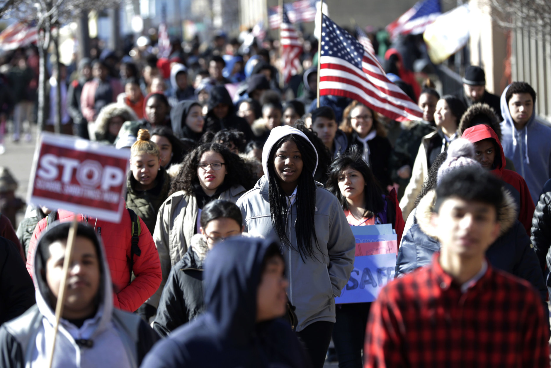 Diamond Bryant, center, a freshman at James Ferris High School walks with classmates during a student walkout, Wednesday, March 14, 2018, in Jersey City, N.J. Students across the country planned to participate in walkouts Wednesday to protest gun violence, one month after the deadly shooting inside a high school in Parkland, Fla. (AP Photo/Julio Cortez)