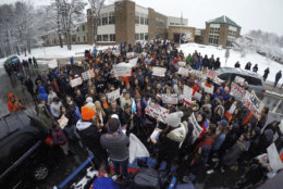 Students at Yarmouth High School participate in a walkout to protest gun violence, Wednesday, March 14, 2018, in Yarmouth, Maine. Leaders of the rally address the crowd from the back of a pick-up truck in front of the school. Yarmouth is one of the few schools in Maine that did not cancel school on Wednesday as the state digs out from the third major winter storm in two weeks. (AP Photo/Robert F. Bukaty)