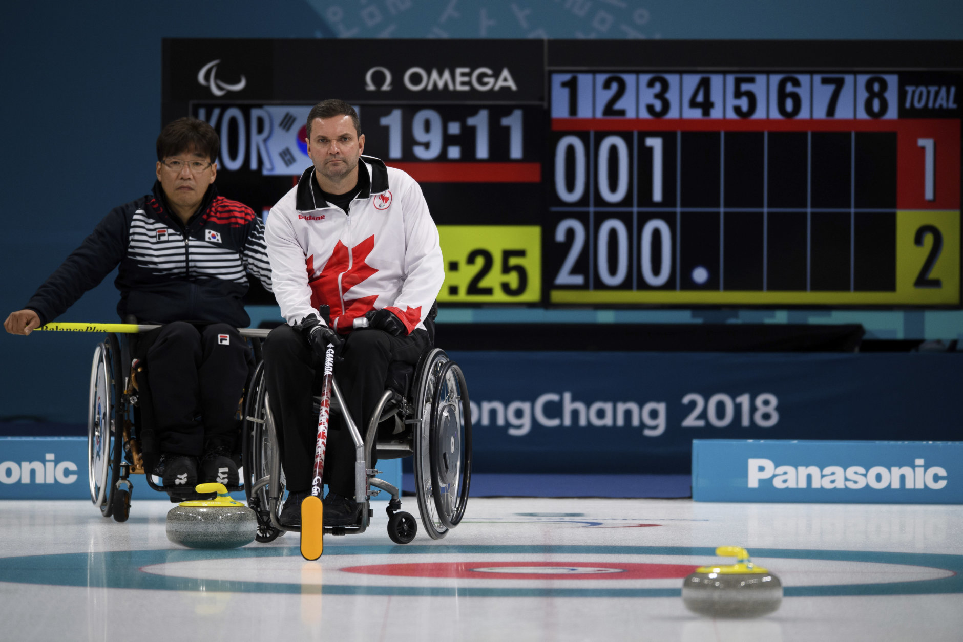 Soonseok Seo, left, of South Korea and Mark Ideson of Canada in action during the Wheelchair Curling Bronze Medal Game between South Korea and Canada at the Gangneung Curling Centre in Gangneung, South Korea at the 2018 Winter Paralympics Saturday, March 17, 2018. (Joel Marklund/OIS/IOC via AP)