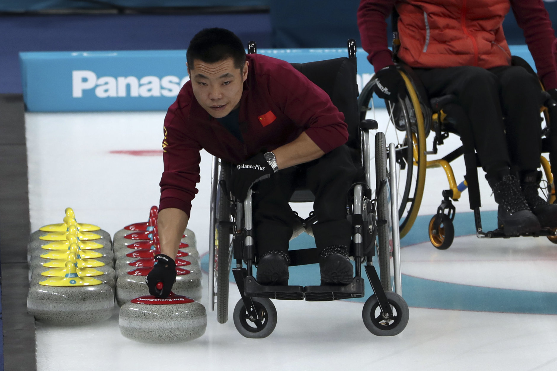 China's Liu Wei prepares a stone for his teammates as they compete against Norway in the Wheelchair Curling gold medal match for the 2018 Winter Paralympics at the Gangneung Curling Centre in Gangneung, South Korea, Saturday, March 17, 2018.(AP Photo/Ng Han Guan)
