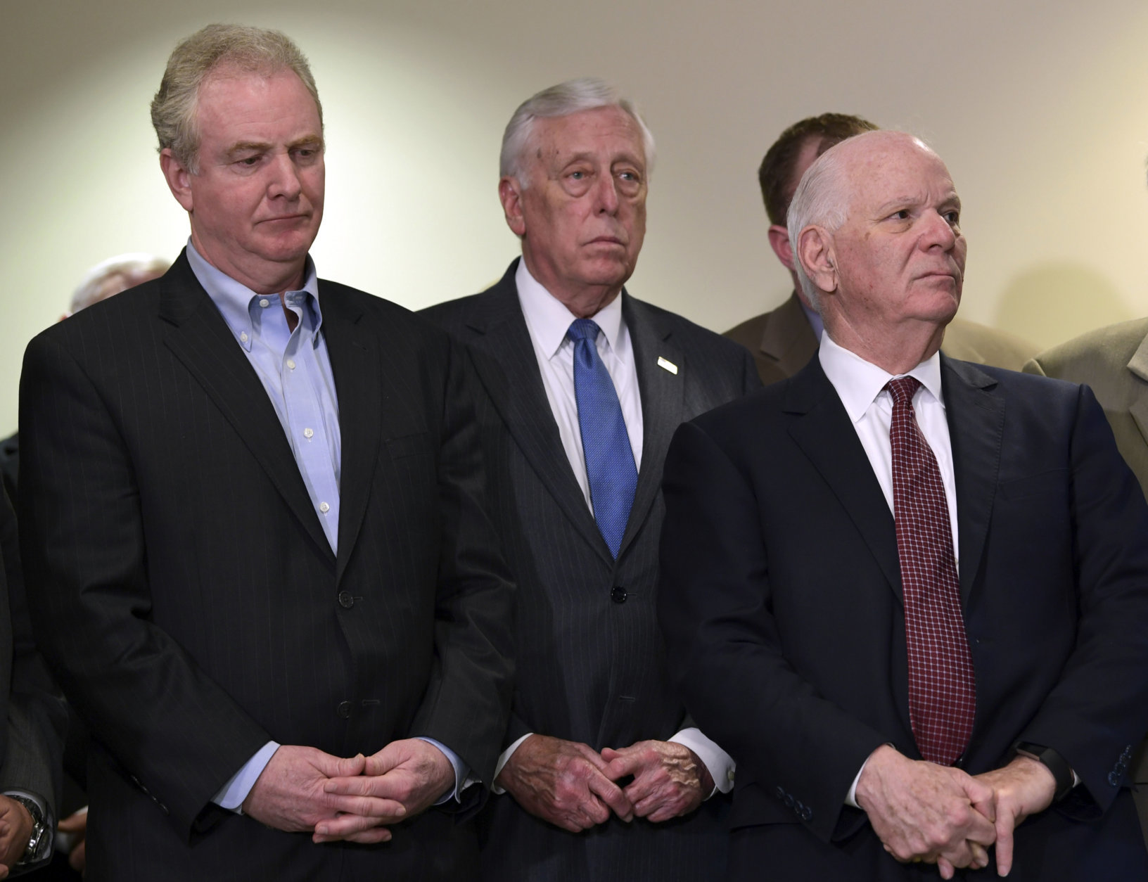 Sen. Chris Van Hollen, D-Md., left, House Minority Whip Steny Hoyer, D-Md., center, and Sen. Ben Cardin, D-Md., right, listen during a news conference about the shooting at Great Mills High School in Great Mills, Md., Tuesday, March 20, 2018. (AP Photo/Susan Walsh)