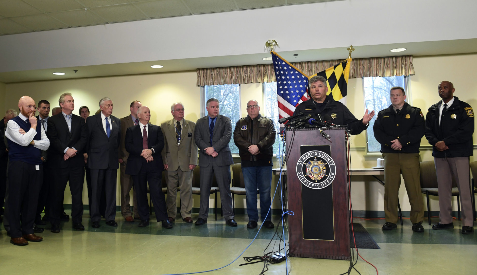 St. Mary's County Sheriff Tim Cameron, third from right, speaks about the shooting at Great Mills High School during a news conference in Great Mills, Md., Tuesday, March 20, 2018. Cameron is joined by Maryland Gov. Larry Hogan, fourth from right. (AP Photo/Susan Walsh)
