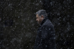 A man walks through falling snow during a winter storm, Tuesday, March 20, 2018, in Philadelphia. (AP Photo/Matt Slocum)