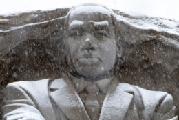 Snow falls on the Martin Luther King Jr., Memorial, Wednesday, March 21, 2018, in Washington, during a spring snow storm. (AP Photo/Jacquelyn Martin)