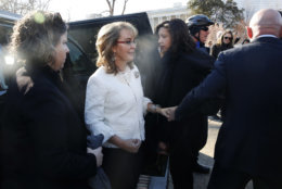 Gabby Giffords, center, is helped by her husband Mark Kelly, right, as they arrive for a news conference about gun violence, Friday,March 23, 2018, on Capitol Hill in Washington, ahead of the Saturday March For Our Lives. The conference was also attended by students and parents from Marjory Stoneman Douglas High School. (AP Photo/Jacquelyn Martin)