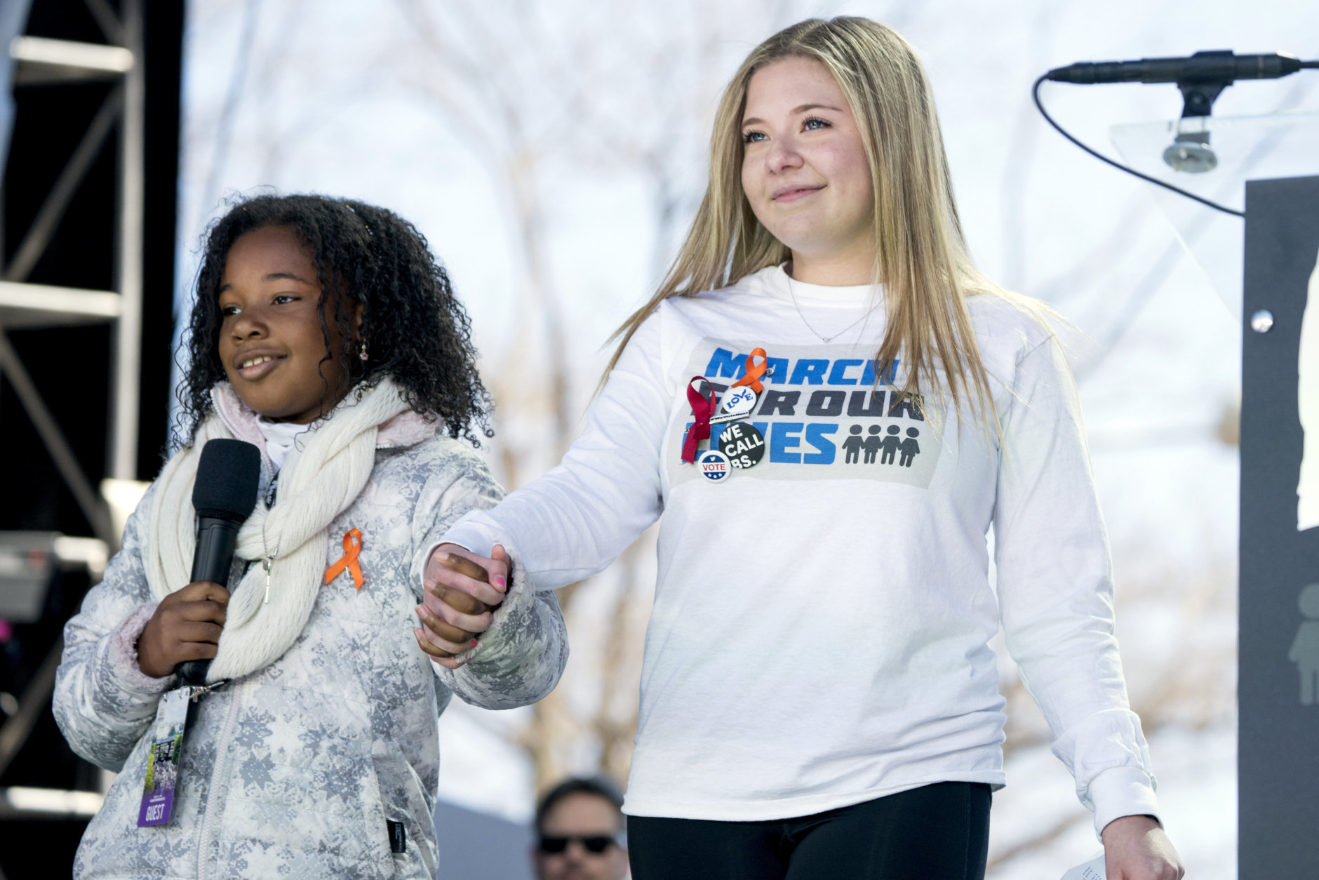 Yolanda Renee King, grand daughter of Martin Luther King Jr., left, accompanied by Jaclyn Corin, a student at Marjory Stoneman Douglas High School in Parkland, Fla., and one of the organizers of the rally, right, speaks during the "March for Our Lives" rally in support of gun control in Washington, Saturday, March 24, 2018. (AP Photo/Andrew Harnik)