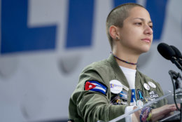 Emma Gonzalez, a survivor of the mass shooting at Marjory Stoneman Douglas High School in Parkland, Fla., closes her eyes and cries as she stands silently at the podium and times the amount of time it took the Parkland shooter to go on his killing spree during the "March for Our Lives" rally in support of gun control in Washington, Saturday, March 24, 2018. (AP Photo/Andrew Harnik)