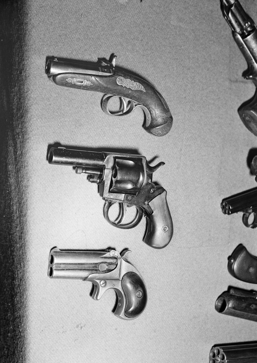 These pistols, identical with those used in the assassination of three presidents of the U.S., are from a collection of some 600 guns owned by C.J. (Charlie) Hurst of West Covina, Calif., shown Aug. 21, 1952. From top: Philadelphia Derringer identical to the one used to assassinate Abraham Lincoln; British Bulldog similar to the type that was used to assassinate James A. Garfield; and a .41 double-barreled Derringer like the one used to assassinate William McKinley. (AP Photo/Don Brinn)