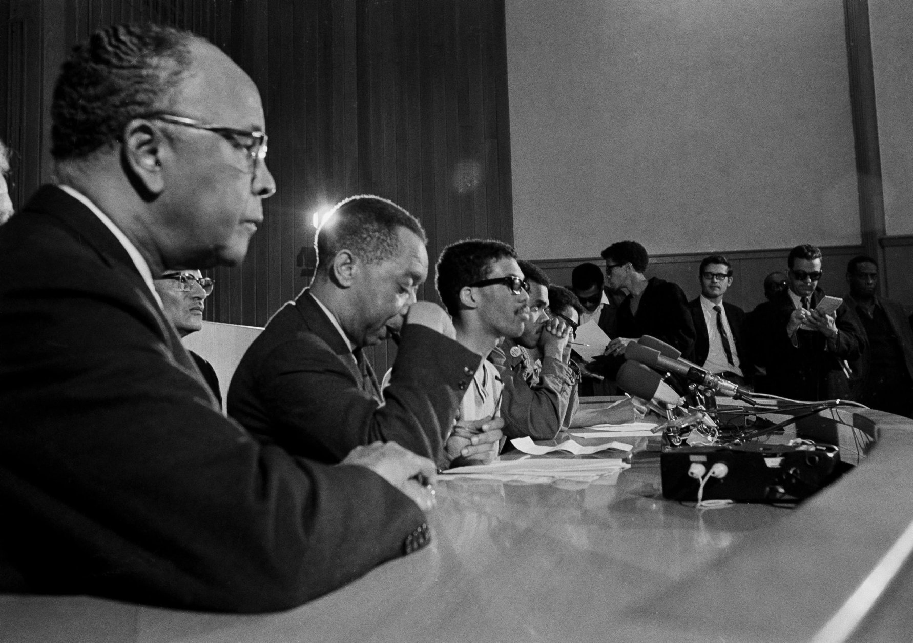 Dr. Kenneth Clark, New York psychologist and member of the board of trustees of Howard University, speaks at a news conference which student leaders in Washington, D.C., March 23, 1968. From left: Clark, Edward Brown, student council president, Tony Gittens and Q. T. Jackson. (AP Photo/Bob Schutz)