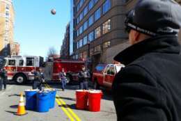Police invited Clarendon Crawl attendees to their anti-drunken driving event where the street was shut down to make room for a giant beer pong game. Participants tried to get a basket while wearing goggles that simulate alcohol impairment. (WTOP/Kathy Stewart) 