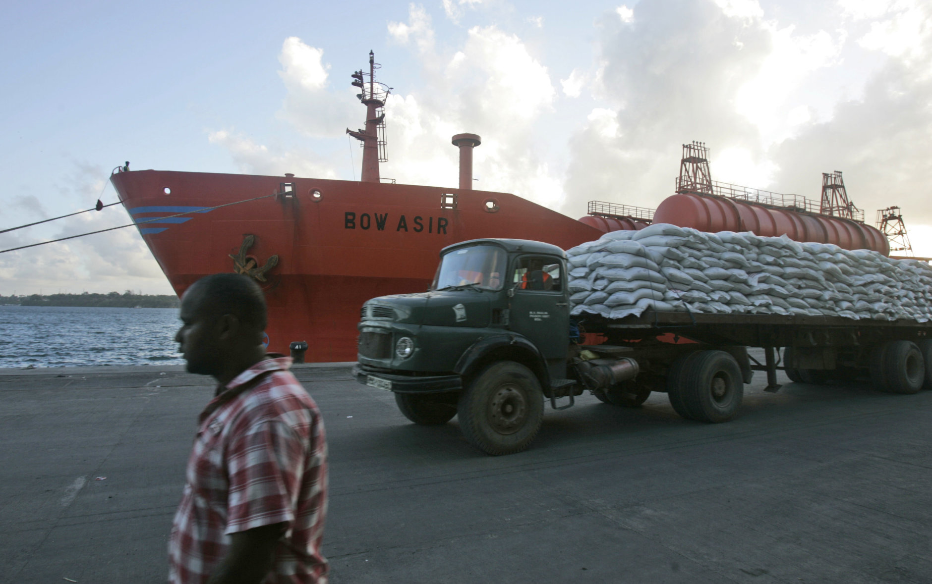 A truck carrying World Food Programe maize drives past the Norwegian-registered Bow Asir, Monday, April 13, 2009 after it  arrived in the port of Mombasa. The owner of a Norwegian tanker says it has been released by Pirates, two weeks after it was seized off the Somali coast, and all 27 of its crew members are unhurt.The 23,000-ton Bow Asir was captured 250 miles (400 kilometers) off the Somali coast March 26 when 16 to 18 pirates carrying machine guns boarded it and took control. (AP Photo / Karel Prinsloo)