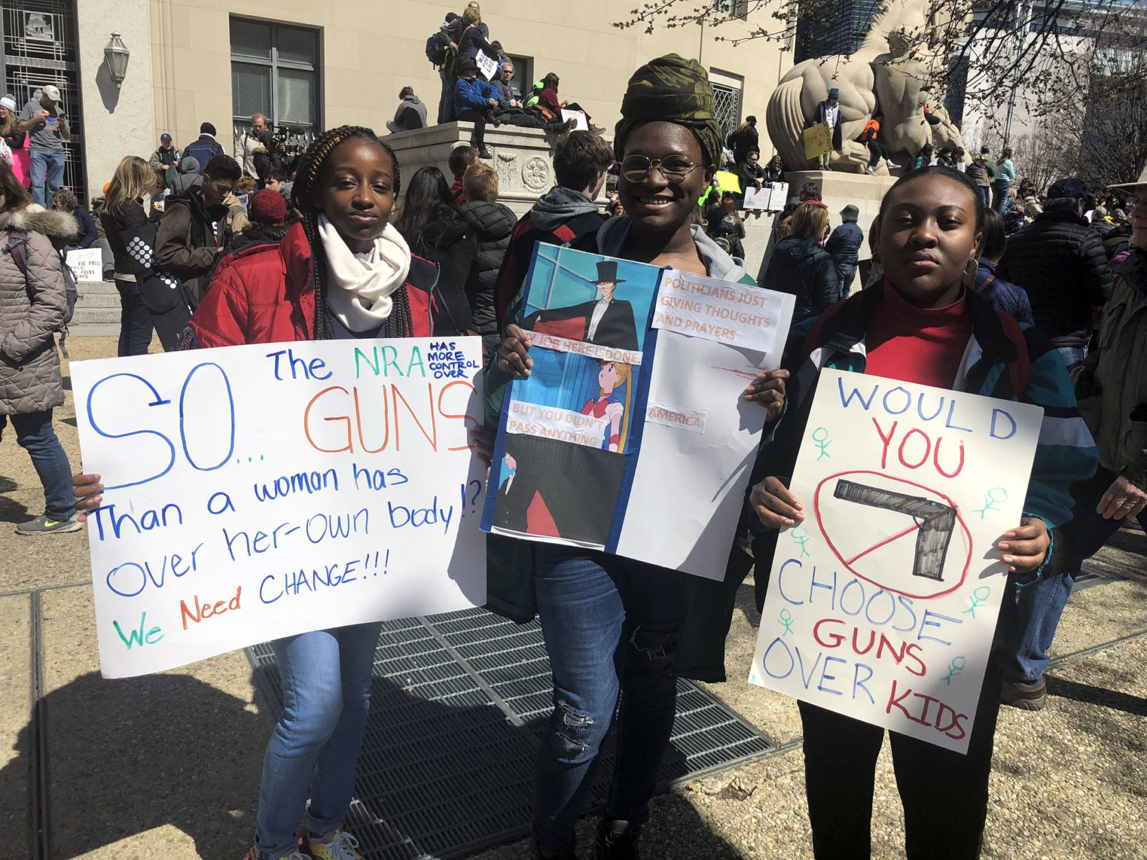 Marchers from Bowie High School with their signs. (WTOP/Melissa Howell)