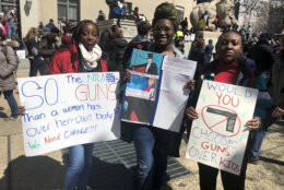 Marchers from Bowie High School with their signs. (WTOP/Melissa Howell)