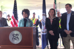 U.S. Transportation Secretary Elaine L. Chao congratulates Loudoun County officials for being the first ever local recipient of a federal TIGER grant. (WTOP/Kristi King)