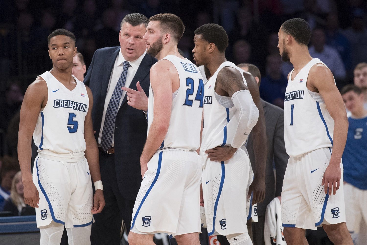 Creighton head coach Greg McDermott, second from left, talks to his team during a time out in the second half of an NCAA college basketball game against Providence in the quarterfinals of the Big East conference tournament, Thursday, March 8, 2018, at Madison Square Garden in New York. Providence won 72-68 in overtime. (AP Photo/Mary Altaffer)