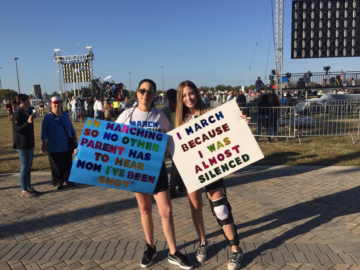 Stoneman Douglas junior Samantha Mayor, 17, was shot in the knee during shooting rampage on Feb. 14. Here she is with mom Ellyn at the March For Our Lives rally in Parkland. (Courtesy of Susannah Bryan on Twitter)