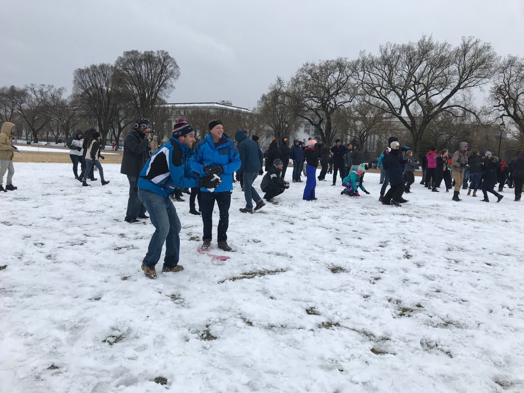 A man prepares to throw a snowball during a snowball fight that organized at the National Mall on Wednesday, March 21, 2018. (WTOP/Dick Uliano)