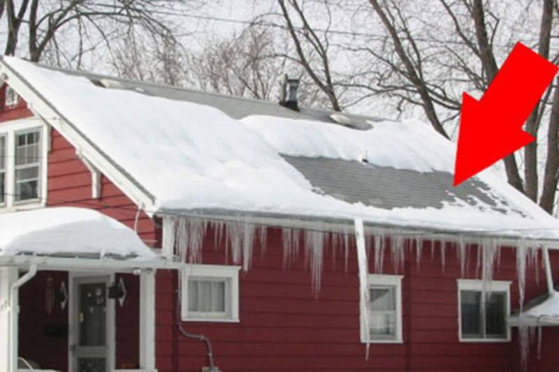 Some times snow melting patterns can be a result of tree limbs over a home, high winds, or areas where the sun can create an odd pattern of snow melting. (Courtesy ARLNow)